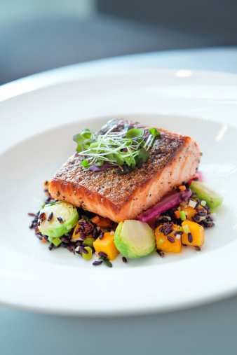 Pan seared salmon on black rice with brussels, squash and chard.  Shallow dof