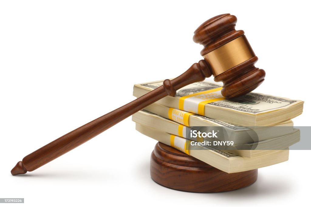 Legal Settlement A conceptual look at money and the legal system. Clipping path included Auction Stock Photo