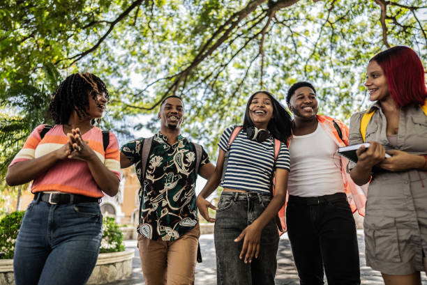 istock University students walking and talking outdoors 1731935024