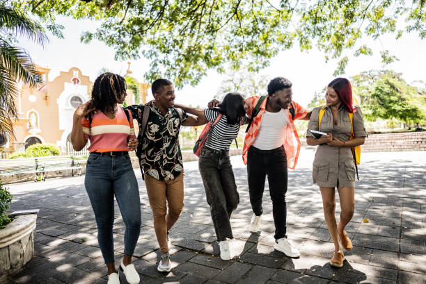 istock University students walking embraced and talking outdoors 1731938321
