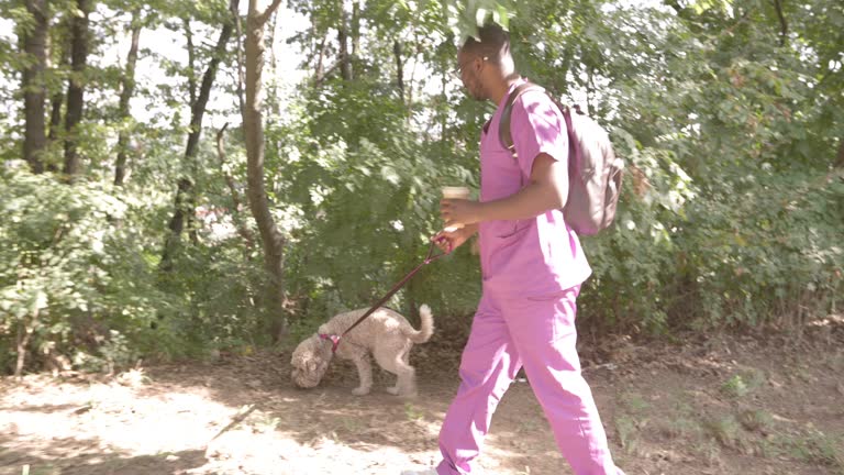 Male Nurse Walks The Dog