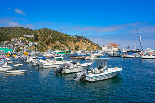 Avalon, CA, USA - September 13, 2023: View of Avalon Harbor with boats and the Catalina Casino building in the background located on Santa Catalina Island.