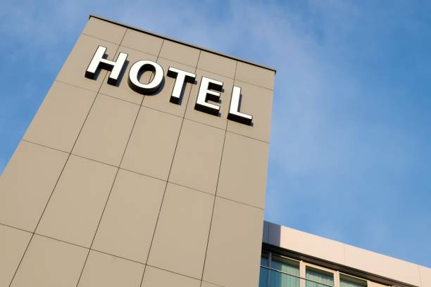 istock hotel sign against blue sky 1731943194