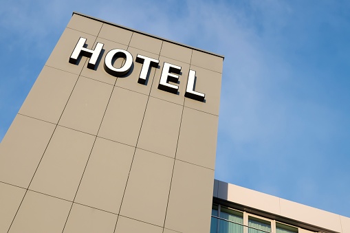 hotel sign against blue sky