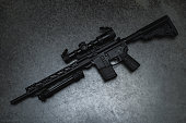 Tactical rifle ar 15 with optical sight and bipod.
