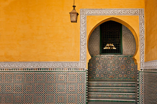 Morocco Yellow wall with traditional arc, Morocco, Meknes. Tomb of Moulay Ismail. meknes stock pictures, royalty-free photos & images