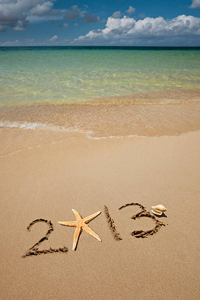 2013 r. - 2013 beach sand new years day zdjęcia i obrazy z banku zdjęć