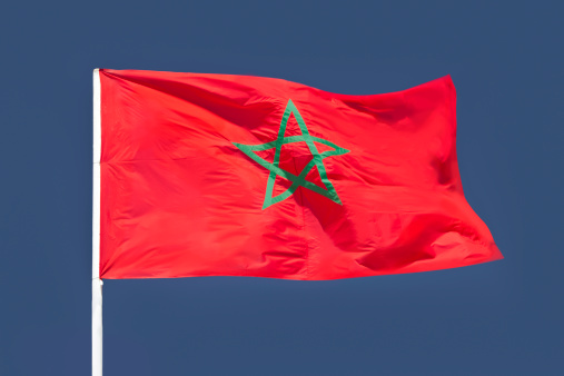 The flag of Morocco waving in the wind.