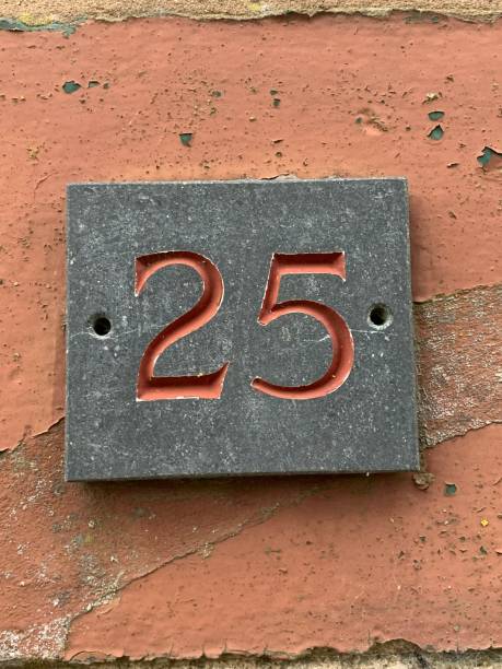 istock Number twenty five stone engraved door sign 1731950396