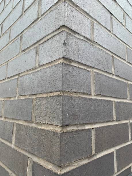 istock Corner of a black brick wall 1731950437