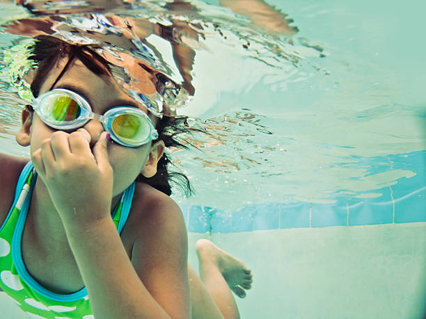 child swimming underwater