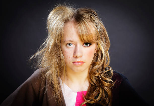 Before and After Teenage Girl A portrait of a Teenage girl. On one side she has messy hair and no makeup, and on the other side she has styled hair and full makeup.  retouching stock pictures, royalty-free photos & images