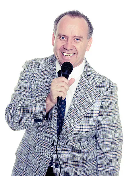 A retro-processed announcer against a white background.