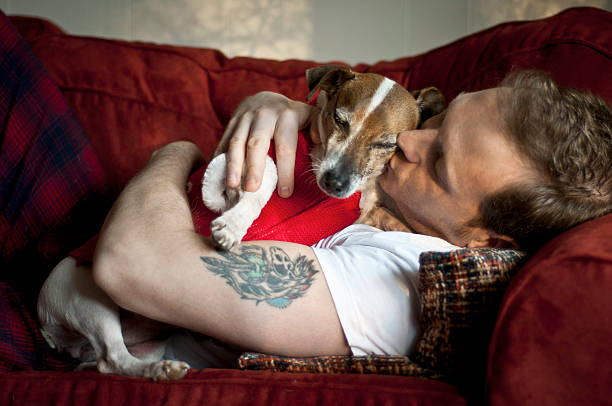 istock Man and dog cuddling 173195749