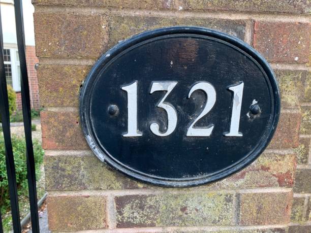 House number 1321 attached to a brick pillar