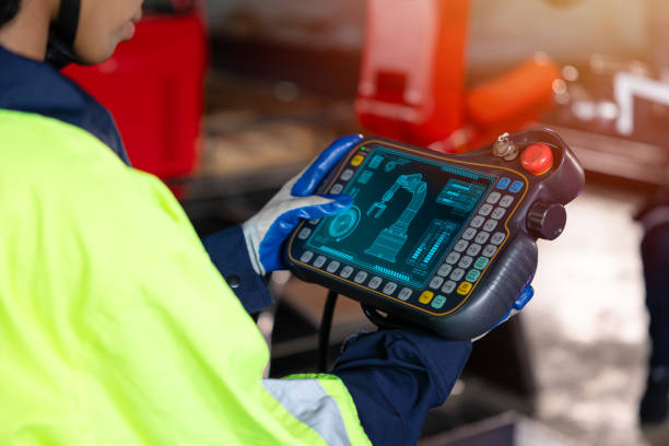 istock Smart engineer staff worker use digital remote control operate industry robot arm in automation factory technology engineering 1731969291