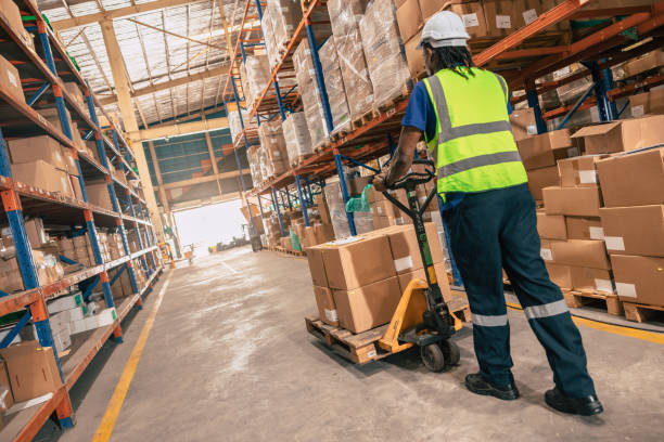 istock Warehouse staff worker load moving parcel for delivery shipping import export goods in shelf storage working area. 1731969801