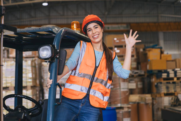 istock happy woman forklift staff worker work in warehouse logistics loading cargo products storage industry 1731969821