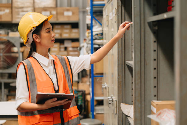 istock Engineer woman work in hardware products warehouse store using tablet parts inventory management software 1731970926