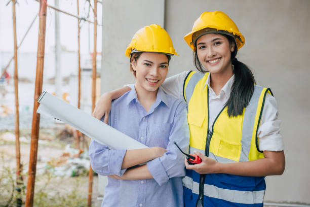 istock Portrait happy smiling construction Engineer women working team together builder architect designer work at construction site 1731970948