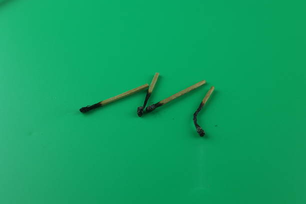 group of Matchstick used burnt green background object to light when no electricity wood strike fire spark flame ancient method cooking cook pay respect free area on the right