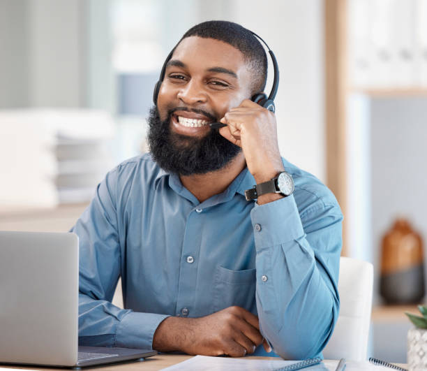 istock Call center, laptop and man, consultant or business agent for information technology, software support or helping. Communication, IT worker or african person in portrait for virtual online consulting 1731994314
