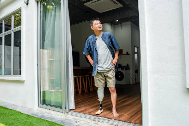 istock man with prosthetic leg standing at home 1732003565