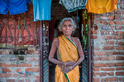 Portrait of an elderly lady from a tribe in India from the Odisha region with her sari