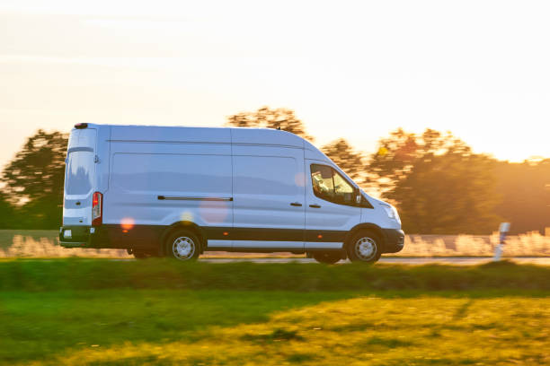 istock White Van driving fast on a country road. 1732024879