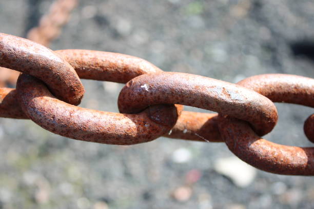istock Close up picture of large heavy rusted iron chains 1732030458