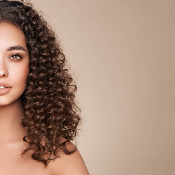 istock Beautiful smiling woman with afro curls 1732031088