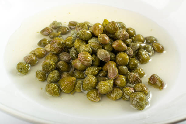 istock Pickled Capers in Brine. Marinated Caper Buds, Small Salted Capparis 1732031644