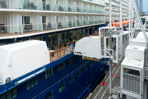 Passengers boarding the cruise ship Celebrity Eclipse via a Port of Vancouver mobile ramp at Canada Place, Vancouver, Canada.