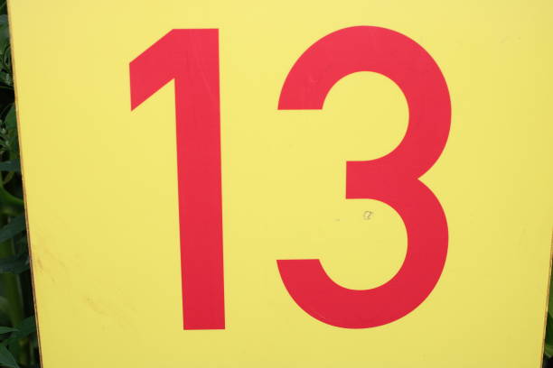istock Number 13 red text on a yellow sign 1732042760