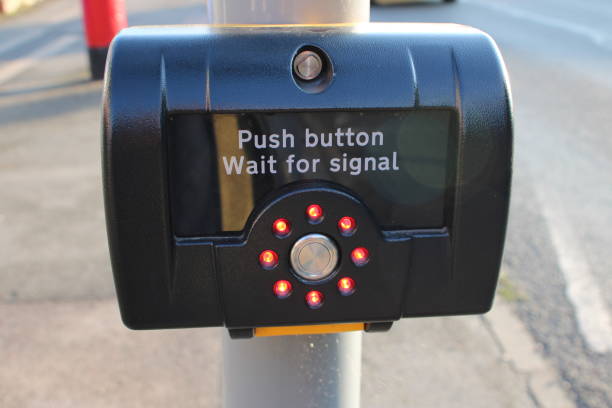 istock Pedestrian crossing point with red illuminated lights in a circle 1732046241
