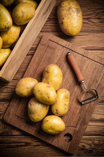 istock Fresh potatoes. On wooden table. 1732046293