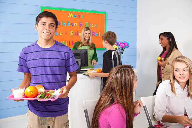 istock Teens in school cafeteria line at check-out. 173205155
