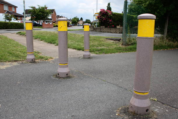 istock Bollards in pavement with yellow band at top 1732052673