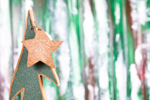 Small wooden Christmas tree with star. 