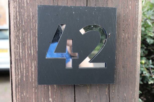 istock Door number 42 black background and silver reflective surface 1732053242