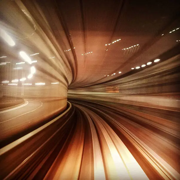 Motion blur image of Tokyo Transit System Line by night - blur of motion of train through a tunnel. 