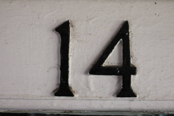 istock Door number 14 close up against a white backdrop 1732090352