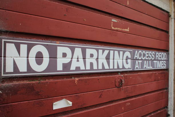 istock Red grungy garage door with sticker No Parking 1732093027
