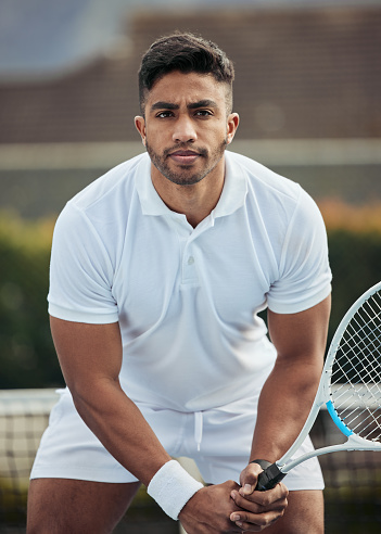 Outdoor, athlete and portrait of man in tennis, competition or game on court with training, exercise or workout. Sports, player or person with serious fitness mindset in healthy match or tournament