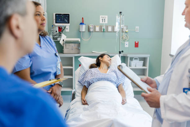 istock Diverse healthcare staff talks about a treatment plan for the sleeping patient 1732097962