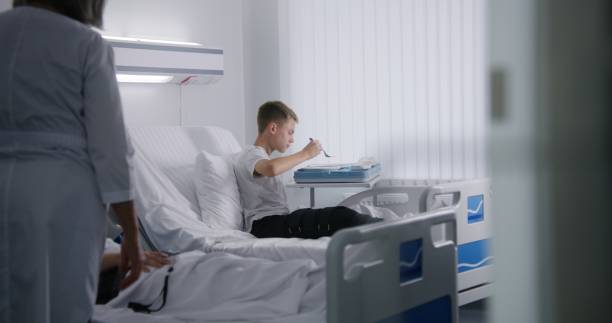 istock Nurse gives lunch box to resting young boy 1732098548