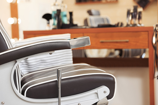 Closeup view of professional barber chair in hairdressing salon
