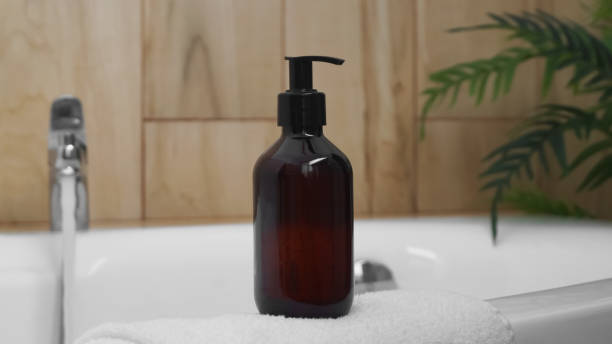 istock Bottle of bubble bath on tub indoors 1732119690
