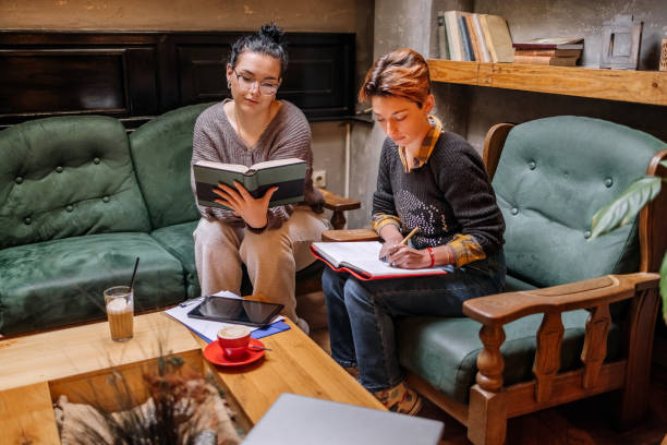 istock Female college students spending time studying together in coffee shop 1732186774