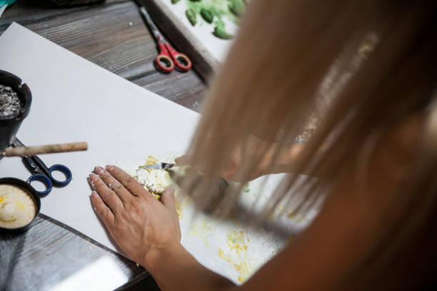 istock Young Woman Making Art By Shaping Putty 1732199030